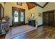 Elegant foyer with wood floors, soaring ceilings, decorative wreaths, and beautiful decor at 5187 Parkview Rd, Social Circle, GA 30025