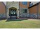 Inviting stone entryway leading to a beautiful home with a stunning, arched double-door entrance at 5187 Parkview Rd, Social Circle, GA 30025