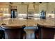 Gourmet kitchen featuring a large island with seating, custom cabinetry, and modern appliances at 5187 Parkview Rd, Social Circle, GA 30025
