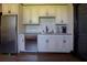 Kitchen area with stainless steel appliances, granite countertops, and custom cabinetry at 5187 Parkview Rd, Social Circle, GA 30025