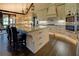 Beautiful kitchen featuring a large island with barstool seating, custom cabinets, and modern appliances at 5187 Parkview Rd, Social Circle, GA 30025