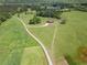 Aerial view showcasing the expansive property, long driveway, and beautiful home at 5187 Parkview Rd, Social Circle, GA 30025