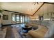 Comfortable living room featuring vaulted ceilings, a large sectional, and a cozy fireplace at 5187 Parkview Rd, Social Circle, GA 30025