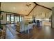 Inviting open-plan living room with vaulted ceilings and seamless transition to the modern kitchen at 5187 Parkview Rd, Social Circle, GA 30025