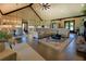 Spacious open-concept living area with hardwood floors, vaulted ceilings, and a seamless flow to the kitchen at 5187 Parkview Rd, Social Circle, GA 30025