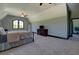 A spacious carpeted main bedroom with large window and a dresser at 5187 Parkview Rd, Social Circle, GA 30025
