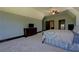 Bright main bedroom featuring carpeted floor and doorway to other rooms at 5187 Parkview Rd, Social Circle, GA 30025
