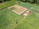 Aerial view of the pasture and fencing with livestock grazing at 5187 Parkview Rd, Social Circle, GA 30025