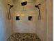 This shower features dual shower heads, built-in niches, and a pebble-stone floor at 5187 Parkview Rd, Social Circle, GA 30025