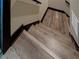 Staircase featuring wood treads, dark stained trim, and white risers at 5187 Parkview Rd, Social Circle, GA 30025