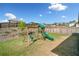 Backyard featuring a playset, a slide and a swing set for outdoor fun and activities at 530 Payne Rd, Woodstock, GA 30188
