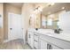 Elegant bathroom with double vanity, white cabinets, and a glass-enclosed shower at 530 Payne Rd, Woodstock, GA 30188
