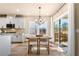 Dining area featuring modern lighting, a table, and chairs, with views of the backyard at 530 Payne Rd, Woodstock, GA 30188