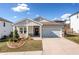 Charming single-story home with a well-manicured lawn, inviting front porch, and a convenient two-car garage at 530 Payne Rd, Woodstock, GA 30188