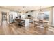 Spacious kitchen with stainless steel appliances, island with seating, and adjacent dining area at 530 Payne Rd, Woodstock, GA 30188