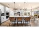 Bright kitchen with a large center island, modern appliances, and stylish pendant lighting at 530 Payne Rd, Woodstock, GA 30188