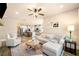 Open-concept living room showcasing seamless flow to kitchen, stylish decor, and ample natural light at 530 Payne Rd, Woodstock, GA 30188