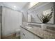 Well-lit bathroom with a granite countertop and a decorative plant enhancing the vanity at 1045 Moreland Se Ave, Atlanta, GA 30316