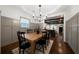 Dining room features a wooden table, wainscoting and dark stained hardwood floors at 1045 Moreland Se Ave, Atlanta, GA 30316
