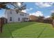Beautiful backyard with a well-maintained lawn, a patio area, and perimeter wooden fencing at 3184 Elmwood Ct, Atlanta, GA 30349