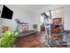 Bright fitness area with exercise machines and hardwood floors, promoting an active lifestyle in your home at 3184 Elmwood Ct, Atlanta, GA 30349