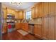 Functional kitchen with wood cabinets, granite countertops, stainless steel appliances, and hardwood floors for style at 3184 Elmwood Ct, Atlanta, GA 30349