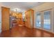Bright kitchen featuring wood cabinets, stainless steel appliances, granite countertops, and hardwood floors at 3184 Elmwood Ct, Atlanta, GA 30349