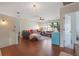 Spacious living room with hardwood floors, ceiling fan, large window, and comfortable seating at 3184 Elmwood Ct, Atlanta, GA 30349