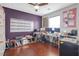 The home office features a large window, hardwood floors, a large whiteboard, and neutral wall colors at 3184 Elmwood Ct, Atlanta, GA 30349