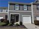 Charming two-story home featuring gray siding, a single-car garage, and a well-manicured front lawn at 3333 Tarian Way, Decatur, GA 30034