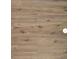 Close-up of stylish wood-look laminate flooring, showcasing its natural texture and light brown tone at 3333 Tarian Way, Decatur, GA 30034