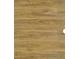 Close-up of brown oak-look vinyl flooring, featuring its natural texture and warm wood grain pattern at 3333 Tarian Way, Decatur, GA 30034