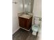 Small bathroom featuring a vanity, sink, mirror, and toilet with vinyl flooring at 3628 Hopkins Ct, Powder Springs, GA 30127