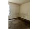 Bedroom featuring brown carpet, mold, and white walls with a window at 3628 Hopkins Ct, Powder Springs, GA 30127