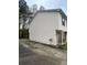 Side view of a two-story home with siding and a driveway on the left side at 3628 Hopkins Ct, Powder Springs, GA 30127