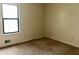 Standard bedroom featuring one window and carpeted floors needing some repairs at 3634 Hopkins Ct, Powder Springs, GA 30127