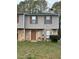 Charming two-story home with stone accents and neutral siding, complemented by well-maintained landscaping at 3634 Hopkins Ct, Powder Springs, GA 30127