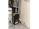 Utility area featuring a Goodman furnace and water heater with accessible plumbing and electrical connections at 3634 Hopkins Ct, Powder Springs, GA 30127
