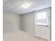 Finished basement area, featuring access to outside with carpet and a drop ceiling at 674 Fairview Dr, Dallas, GA 30157