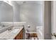 Clean bathroom featuring granite countertops, wooden cabinets, and a bathtub with tile surround at 674 Fairview Dr, Dallas, GA 30157