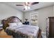 Cozy bedroom with a plush bed, bedside table, and window providing natural light at 674 Fairview Dr, Dallas, GA 30157
