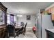 Traditional dining room with a large table, chairs, and a hutch near the kitchen appliances at 674 Fairview Dr, Dallas, GA 30157