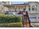 View of the front porch of the home with stairs leading up to the door at 674 Fairview Dr, Dallas, GA 30157