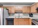 Functional kitchen with stainless appliances, wood cabinets, granite countertops, and ample workspace at 674 Fairview Dr, Dallas, GA 30157