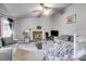 Cozy living room with fireplace, comfortable seating, and access to the staircase at 674 Fairview Dr, Dallas, GA 30157