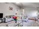 Inviting living area featuring carpet floors, modern furniture, and staircase access to the upper level at 674 Fairview Dr, Dallas, GA 30157