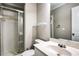 Bathroom features a shower with glass doors, toilet, sink, a large mirror, and modern fixtures at 7 Chief Matthews Rd # 2A, Decatur, GA 30030