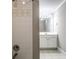 Elegant bathroom featuring a tile shower and vanity with modern fixtures at 7 Chief Matthews Rd # 2A, Decatur, GA 30030