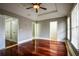 Spacious bedroom with hardwood floors, fan, tray ceiling, and sun-filled windows at 7 Chief Matthews Rd # 2A, Decatur, GA 30030