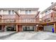 Townhouse exterior with garages and elevated wooden decks at 7 Chief Matthews Rd # 2A, Decatur, GA 30030